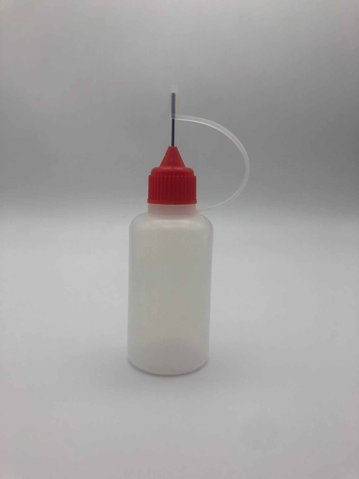 Bottle with Needle Spout Cap